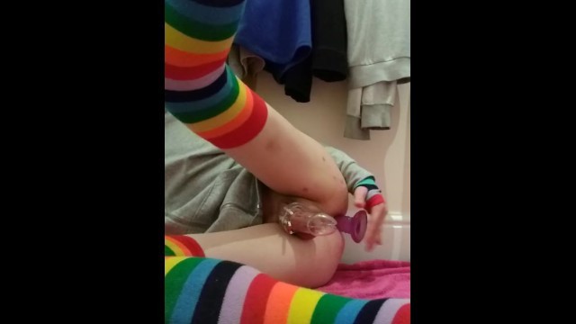 Femboy in Rainbow Thighhighs and Chastity Cage uses 6 Inch Dildo in the Ass