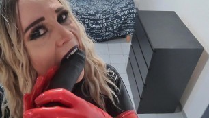 Sexy skinny Latex Vamp Girl makes video call with a friend