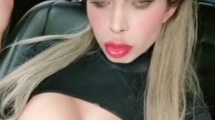 Tranny showing her body in the car to her fans on camera for losing bet