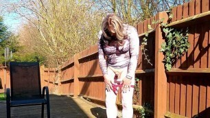 Amateur crossdresser Kelly CD enjoying her sissy girl cock in the garden