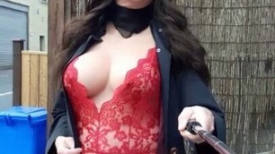 Crossdressed on the street outside a pub in sexy lingerie and stockings