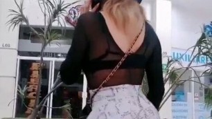tranny girl in a public square showing her ass to those who pass anal